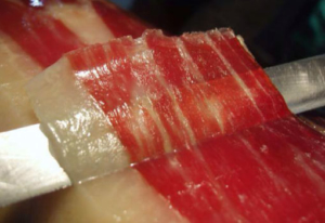 Acorn-fed Iberian ham cut by hand
